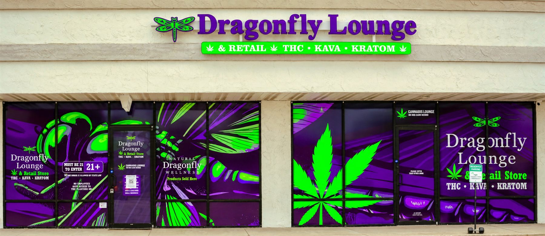 Dragonfly Lounge storefront at 1537 Atlantic Blvd, Neptune Beach, with purple and green window graphics